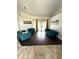 Bright living room boasts stylish furniture and a view of the pool from the French doors at 2659 Hibbard Trl, Chuluota, FL 32766