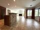 Open-concept living area with island, fireplace, and large windows at 2659 Hibbard Trl, Chuluota, FL 32766