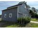 Unique two-story outbuilding with classic barn doors enhances the property's appeal at 2659 Hibbard Trl, Chuluota, FL 32766