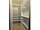 Walk-in pantry with custom white shelving for optimal storage and organization at 2659 Hibbard Trl, Chuluota, FL 32766