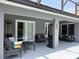 Covered patio with plenty of seating and outdoor heaters, perfect for entertaining at 2659 Hibbard Trl, Chuluota, FL 32766