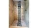Close-up of a walk-in shower featuring decorative tile and built in niche at 2659 Hibbard Trl, Chuluota, FL 32766