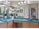 Dual vanity bathroom with large mirror, cabinets, and plenty of counter space at 2710 Autumn Ln, Eustis, FL 32726