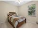 Comfortable bedroom with a window and a bed at 2710 Autumn Ln, Eustis, FL 32726