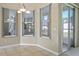 Bright breakfast nook featuring tiled floors, three windows, and natural light at 2710 Autumn Ln, Eustis, FL 32726