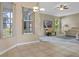 Open-concept breakfast nook next to living room, featuring tiled floors at 2710 Autumn Ln, Eustis, FL 32726