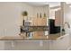 Eat-in kitchen featuring granite countertops and stainless steel appliances at 2710 Autumn Ln, Eustis, FL 32726