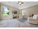 Spacious living room with large windows and carpeted flooring at 2710 Autumn Ln, Eustis, FL 32726
