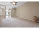 Spacious living room with neutral carpet, high ceilings, and ample natural light at 2710 Autumn Ln, Eustis, FL 32726