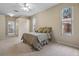 Primary bedroom suite features carpeted floors, multiple windows and a bed at 2710 Autumn Ln, Eustis, FL 32726