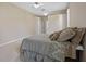 Primary bedroom with carpet floors, ensuite bathroom and a king bed at 2710 Autumn Ln, Eustis, FL 32726