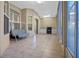 Enclosed patio featuring tile flooring, seating and an outdoor cooking area at 2710 Autumn Ln, Eustis, FL 32726