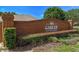 Brick signage at the community entrance, surrounded by green landscaping at 2710 Autumn Ln, Eustis, FL 32726