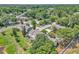 Aerial view of homes surrounded by lush greenery and trees in a residential area at 283 Woodgreen Ln, Winter Springs, FL 32708