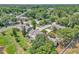 Aerial view of homes surrounded by lush greenery and trees in a residential area at 283 Woodgreen Ln, Winter Springs, FL 32708