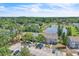 An aerial view of the community with a pond and mature trees at 283 Woodgreen Ln, Winter Springs, FL 32708