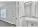 Bathroom boasts pedestal sink and decorative tile accents at 283 Woodgreen Ln, Winter Springs, FL 32708