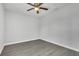 Bright bedroom with wood-look floors and ceiling fan at 283 Woodgreen Ln, Winter Springs, FL 32708