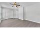 Large bedroom features a ceiling fan, wood-look flooring, and ample closet space at 283 Woodgreen Ln, Winter Springs, FL 32708