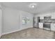 Bright and airy kitchen with stainless steel appliances, tile flooring, and a glass door to the backyard at 283 Woodgreen Ln, Winter Springs, FL 32708