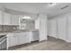 Updated kitchen features stainless steel appliances, granite countertops, and stylish tile backsplash at 283 Woodgreen Ln, Winter Springs, FL 32708