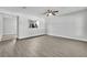 Spacious living room featuring modern laminate flooring, neutral paint, and ample natural light at 283 Woodgreen Ln, Winter Springs, FL 32708