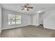 Inviting living room features new laminate floors, a large window and a staircase at 283 Woodgreen Ln, Winter Springs, FL 32708