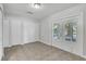 Neutral room features tiled floors and sliding glass doors with backyard views at 283 Woodgreen Ln, Winter Springs, FL 32708