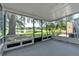 A screened porch provides views of a pond with a fountain at 283 Woodgreen Ln, Winter Springs, FL 32708