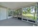 This screened in lanai overlooks the community grounds and pond at 283 Woodgreen Ln, Winter Springs, FL 32708