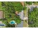 Aerial view of house features a pool and mature trees at 3007 Huntington St, Orlando, FL 32803