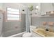 Retro bathroom showcases a tiled shower, tub, and unique fixtures at 3007 Huntington St, Orlando, FL 32803
