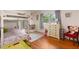 Charming bedroom with a bunk bed, hardwood floors, and natural light from the window at 3007 Huntington St, Orlando, FL 32803