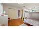 Bright bedroom features hardwood floors, bunk beds, closet, and decor at 3007 Huntington St, Orlando, FL 32803