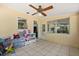 Bright bonus room features a ceiling fan, neutral tile flooring and natural light from the windows at 3007 Huntington St, Orlando, FL 32803