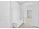 Hallway with a built in bench and hooks for coats and bags at 304 N Jungle Rd, Geneva, FL 32732