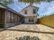 Backyard featuring stone patio and enclosed porch at 306 Foxboro Ct, Lake Mary, FL 32746