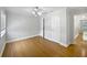 Light and airy bedroom with hardwood floors, ceiling fan and windows at 306 Foxboro Ct, Lake Mary, FL 32746