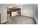 Dining room adjacent to the kitchen with stainless steel appliances and hardwood floors at 306 Foxboro Ct, Lake Mary, FL 32746
