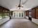 Enclosed porch with tile floors, windows, and fan at 306 Foxboro Ct, Lake Mary, FL 32746