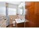 Bathroom with a vanity, updated lighting, and a tiled shower-tub combo at 3118 Walnut St, Winter Haven, FL 33881