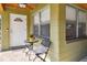 Inviting front porch featuring a cozy seating area and a decorative entrance door at 3118 Walnut St, Winter Haven, FL 33881