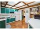 Functional kitchen with custom colored cabinets, tile backsplash, and a vintage feel at 3118 Walnut St, Winter Haven, FL 33881