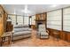 Spacious living room with tile floors, brick fireplace, and comfortable seating at 3118 Walnut St, Winter Haven, FL 33881