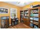 Bright office space with lots of natural light, hardwood floors, and built-in wooden bookcases at 3118 Walnut St, Winter Haven, FL 33881