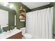 Stylish bathroom with modern vanity, decorative shelves, and a shower featuring a white curtain at 3270 Courtland Blvd, Deltona, FL 32738