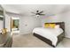 Cozy bedroom with a spacious bed, warm lighting, and a glimpse into a stylish living area at 3270 Courtland Blvd, Deltona, FL 32738