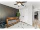 Contemporary Bedroom with a wooden crib, striking accent wall, patterned rug, and ample natural light at 3270 Courtland Blvd, Deltona, FL 32738