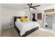 Comfortable bedroom with a large bed, wood accents, and a glimpse into an organized walk-in closet at 3270 Courtland Blvd, Deltona, FL 32738