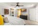 Serene bedroom featuring soft lighting, a dark dresser, and a TV for a relaxing atmosphere at 3270 Courtland Blvd, Deltona, FL 32738